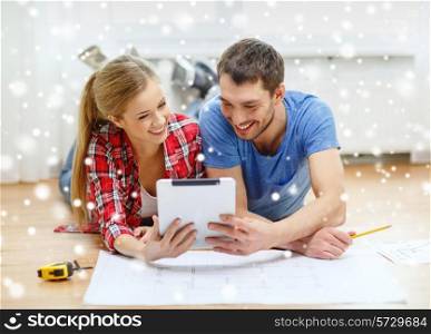 repair, building, renovation, technology and people concept - smiling couple with blueprint looking at tablet pc at home