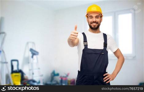 repair, construction and building concept - happy smiling male worker or builder in yellow helmet and overall showing thumbs up over room with equipment on background. male worker or builder showing thumbs up