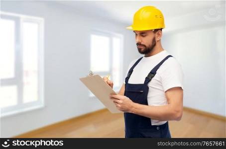 repair, construction and building concept - male worker or builder in helmet with clipboard over empty room at new home on background. male worker or builder in helmet with clipboard