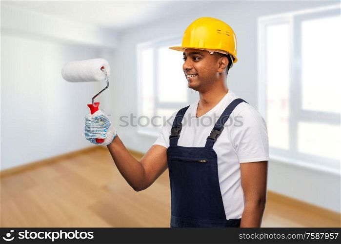 repair, construction and building - happy smiling indian builder or painter in helmet with paint roller over empty room at new home or apartment background. happy indian painter or builder with paint roller