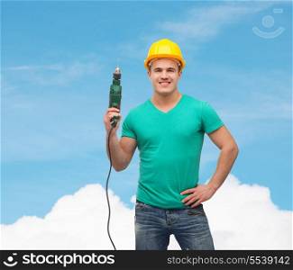 repair, construction and maintenance concept - smiling male manual worker in protective helmet with drill machine
