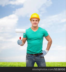 repair, construction and maintenance concept - smiling male manual worker in protective helmet with paint roller