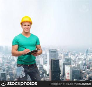 repair, construction and maintenance concept - smiling man in helmet with clipboard