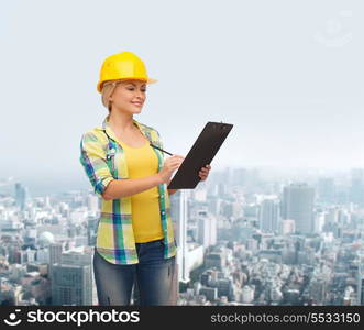 repair, construction and maintenance concept - smiling woman in helmet with clipboard