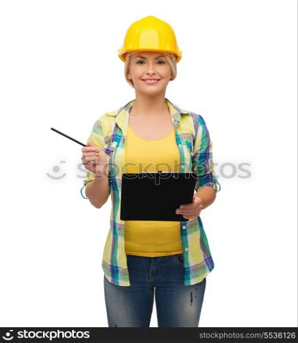 repair, construction and maintenance concept - smiling woman in helmet with clipboard
