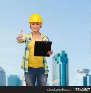 repair, construction and maintenance concept - smiling woman in helmet with clipboard showing thumbs up