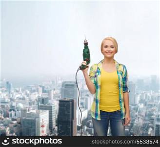 repair, construction and maintenance concept - smiling woman with drill machine