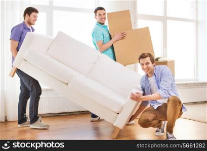 repair, furniture, decorating and home concept - smiling friends with sofa and cardboard boxes