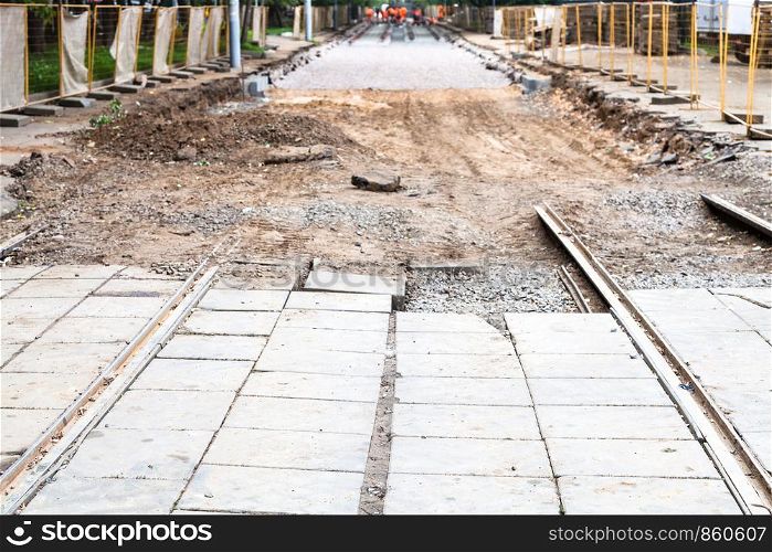 repair of tram tracks in Moscow city - disassembled tram road and laying of new rails on the tram track