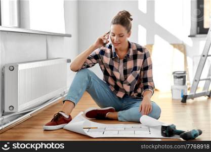 repair, people and real estate concept - woman with blueprint and pencil sitting on floor at home and calling on smartphone. woman with blueprint calling on smartphone at home