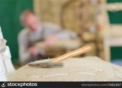 repairing a chair in a workshop