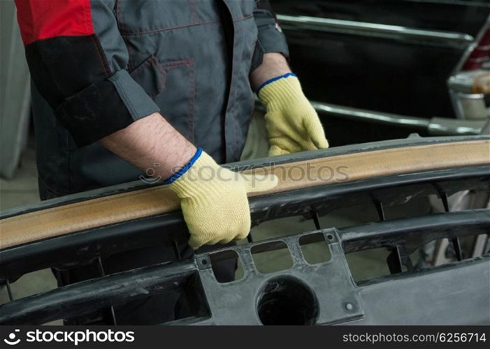 Repairing automotive body. Repairing automotive body closeup photo