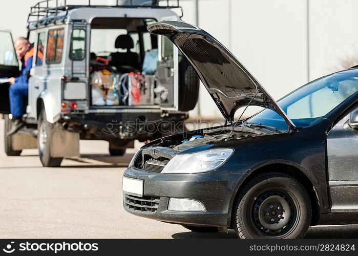 Repairing service man with damaged car trouble problem crash breakdown