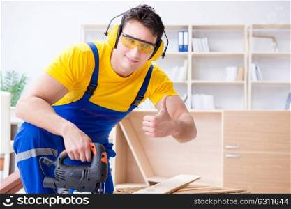 Repairman carpenter cutting sawing a wooden board with an electr. Repairman carpenter cutting sawing a wooden board with an electric power saw