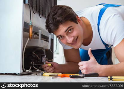 Repairman contractor repairing fridge in DIY concept