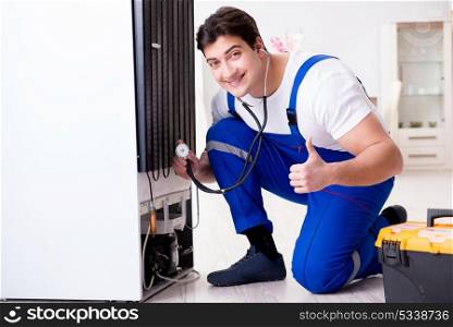 Repairman contractor repairing fridge in DIY concept