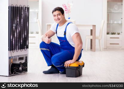 Repairman contractor repairing fridge in DIY concept