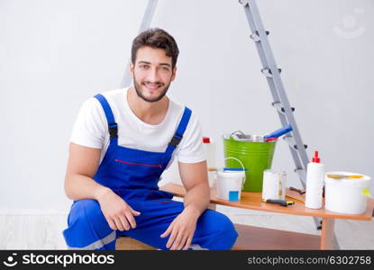 Repairman doing renovation repair in the house with paper wallpa. Repairman doing renovation repair in the house with paper wallpaper