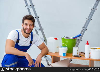 Repairman doing renovation repair in the house with paper wallpa. Repairman doing renovation repair in the house with paper wallpaper