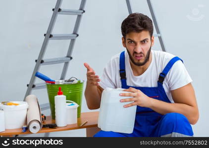 Repairman doing renovation repair in the house with paper wallpaper. Repairman doing renovation repair in the house with paper wallpa