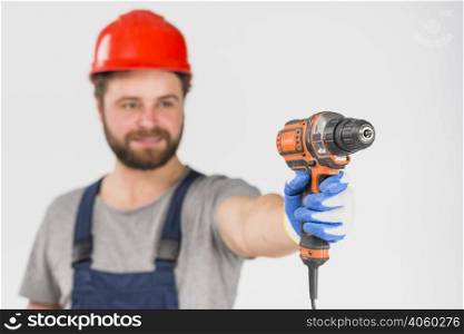 repairman holding drill hand