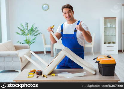 Repairman repairing broken chair at home