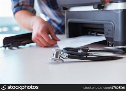 Repairman repairing broken color printer