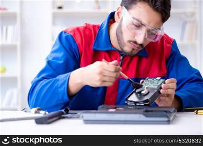 Repairman working in technical support fixing computer laptop tr. Repairman working in technical support fixing computer laptop troubleshooting