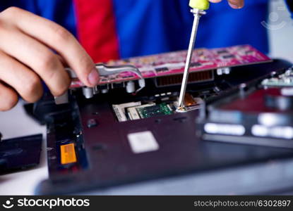 Repairman working in technical support fixing computer laptop tr. Repairman working in technical support fixing computer laptop troubleshooting