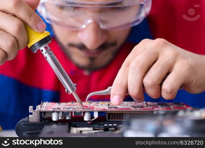 Repairman working in technical support fixing computer laptop tr. Repairman working in technical support fixing computer laptop troubleshooting