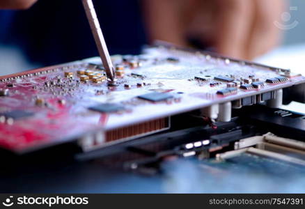 Repairman working in technical support fixing computer laptop troubleshooting. Repairman working in technical support fixing computer laptop tr