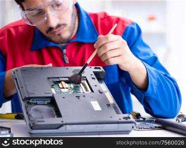 Repairman working in technical support fixing computer laptop troubleshooting. Repairman working in technical support fixing computer laptop tr