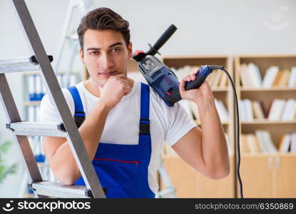 Repairman working with drilling drill perforator