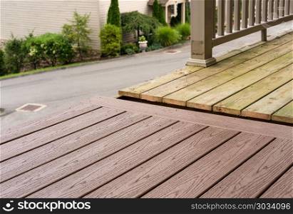 Replacement of old wooden deck with composite material. Repair and replacement of an old wooden deck or patio with modern composite plastic material