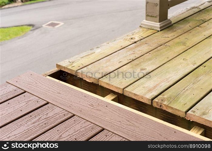 Replacement of old wooden deck with composite material. Repair and replacement of an old wooden deck or patio with modern composite plastic material. Replacement of old wooden deck with composite material