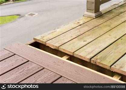 Replacement of old wooden deck with composite material. Repair and replacement of an old wooden deck or patio with modern composite plastic material. Replacement of old wooden deck with composite material