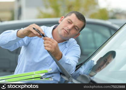 replacing the wipers of the car