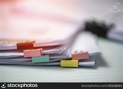 Report paper document present financial and business report with colorful paper clip on office table background
