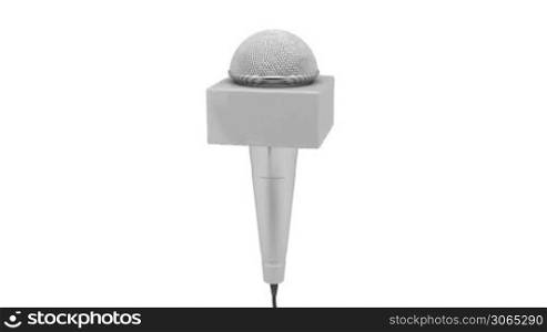 Reporter microphone rotates on white background