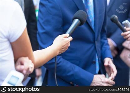 Reporters making media interview with businessman or politician