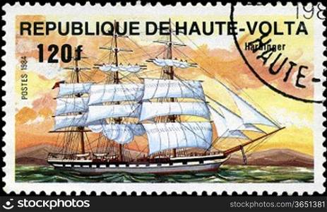 REPUBLIC OF UPPER VOLTA- CIRCA 1984: A stamp printed in Republic of Upper Volta shows the ship &acute;Harbinger&acute;, series is devoted to sailing vessels, circa 1984