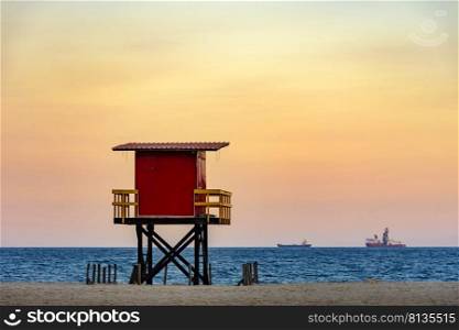 Rescue cabin on Copacabana beach at a tropical sunset on Rio de Janeiro city, Brazil. Beach rescue cabin at sunset
