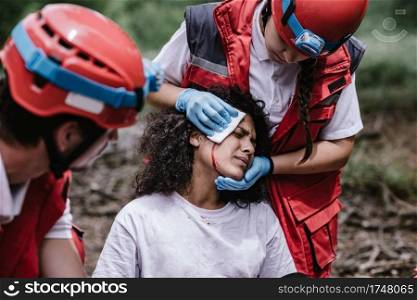 Rescue team treating injuries in the field