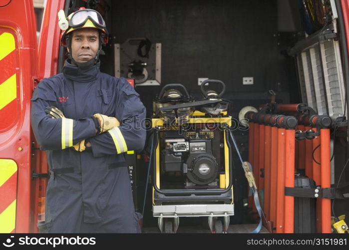 Rescue worker standing by open back door of rescue vehicle