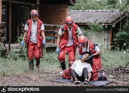 Rescue workers at the disaster scene, saving people