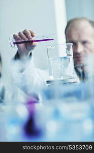 research and science doctor student people in bright laboratory representing chemistry education and medicine concept