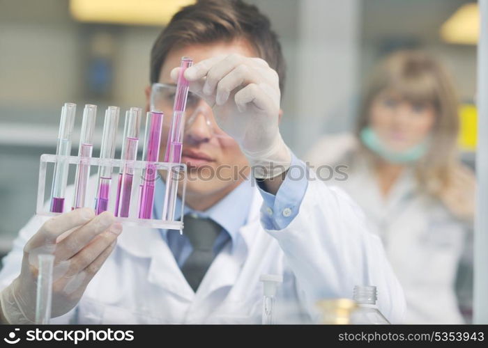 research and science doctor student people in bright laboratory representing chemistry education and medicine concept