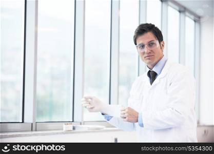 research and science doctor student people in bright laboratory representing chemistry education and medicine concept