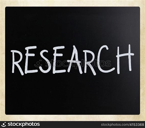 ""Research" handwritten with white chalk on a blackboard"