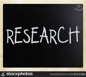 ""Research" handwritten with white chalk on a blackboard"